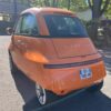 Microlino Orange Amesterdam trois quart arrière droit