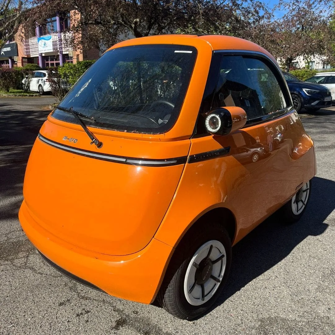 MICROLINO L7 90 km/h orange occasion 2023 4 490 km – voiture électrique permis B1 – vue de face